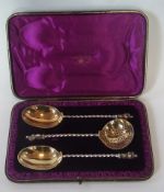 A set of three Victorian silver gilt presentation apostle spoons, comprising:- two spoons and a