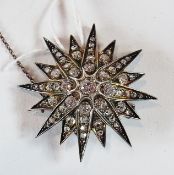 Diamond star brooch  set one large and numerous small diamonds having 16 points, 4.5cm in diameter