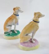 Pair of Continental Parianware seated greyhounds, raised on an oval base, height 15cm