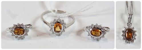 18ct white gold yellow stone and diamond suite of ring, earrings, pendant and chain, the  yellow