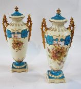 Pair Rudolstadt lidded vases, ovoid shape tapering to square base, floral decoration, gilt rimmed,