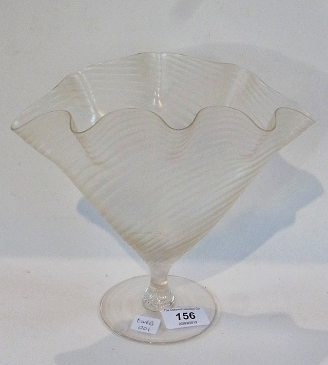 An iridescent glass pedestal vase, wavy and flared, 20cm high