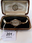 Lady's Buren Grande Prix 9ct gold wristwatch, circular with subsidiary seconds dial on 9ct expanding