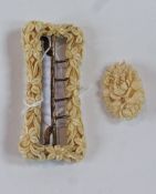 Floral carved ivory buckle, rectangular and a similar oval brooch