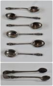 A George V set of six silver apostle coffee spoons, with matching sugar nips, Sheffield 1915, in