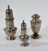 Three early twentieth century silver pepperettes, on raised circular foot, 4oz approx.