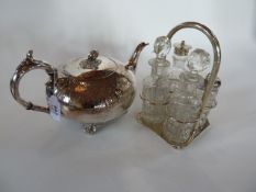 A silverplate teapot, compressed bullet form with pomegranate finial, scroll handle and engraving,