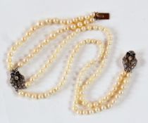 Pearl and diamond necklace, the double graduated string of pearls having two diamond scallopshell