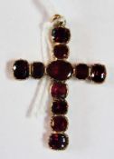 19th century gold coloured metal and almandine garnet cross pendant, set with eleven shaped oval