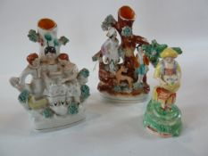 Two various 19th century Staffordshire flatback figure group spill vases together with a figurine (