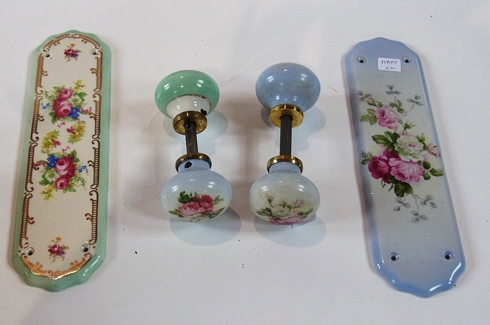 A quantity of china door plates, painted with roses on a pale blue ground and various china door