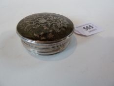 Antique tortoiseshell and silver pique circular snuff box, the cover with rococo trailing floral and
