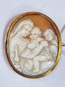 Cameo brooch carved with Virgin Mother, child and St John in gold coloured oval mount
