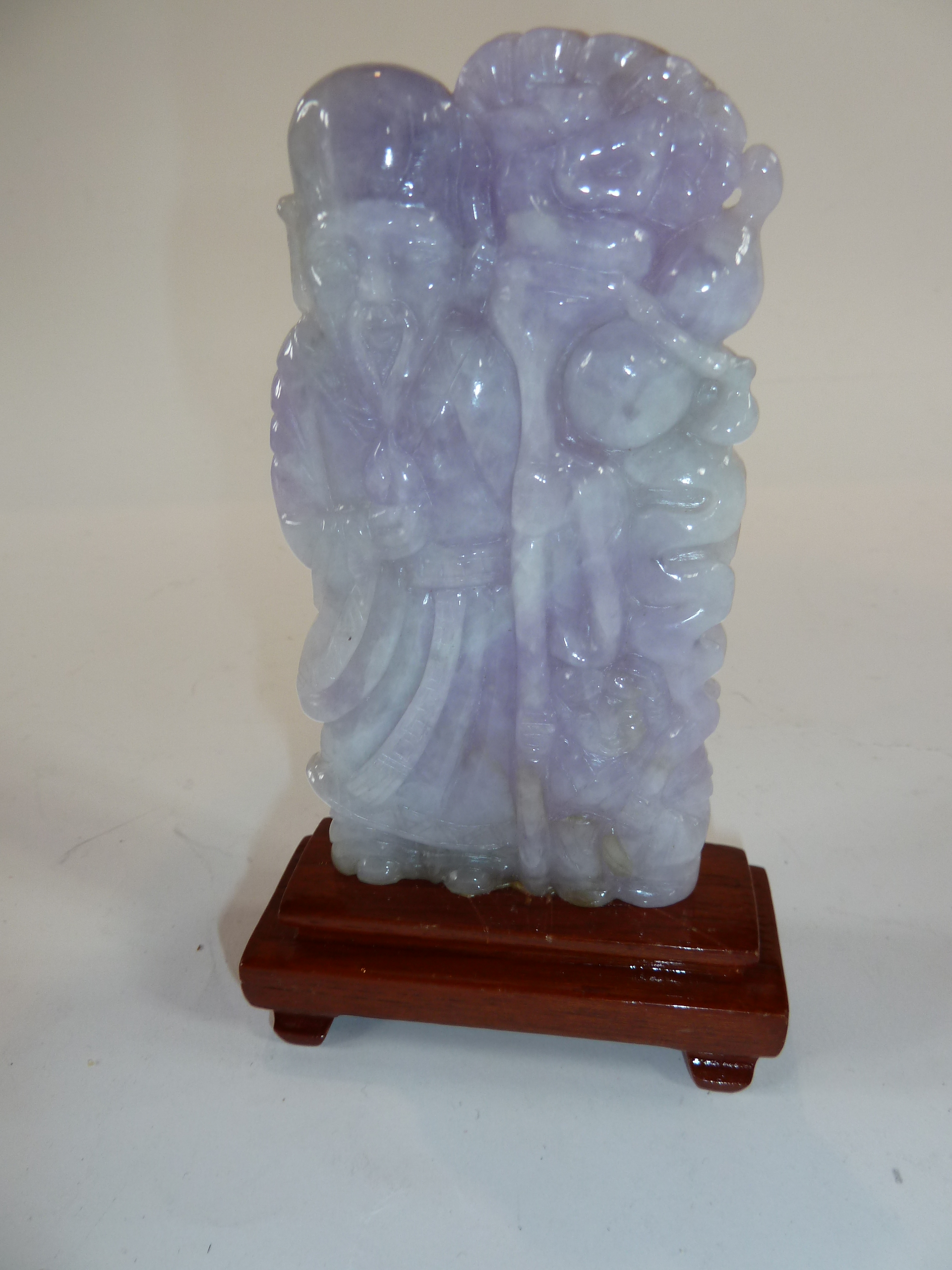 Chinese carved amethyst jade figure of a sage with staff, of flattened form, 15cm high