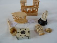 Carved ivory slender spire, carved ivory mask, two cricket cages, bone, millefiore clad small box