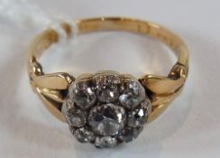 18ct gold and diamond cluster ring, with centre diamond having surround of eight stones and on