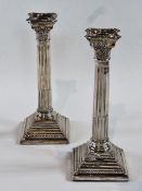 Pair silver Corinthian column candlesticks, with fluted columns and square stepped bases, Birmingham