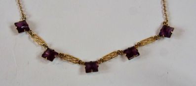 Gold and purple stone necklace