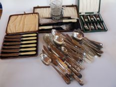 Quantity of assorted silverplated flatware, including:- berry spoon, boxed set of cake knives with