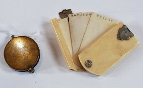 Small ivory folding notebook with white metal mounts and a metal folding magnifying glass (2)