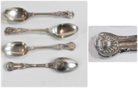 Edwardian silver shell pattern spoons, comprising:- three tablespoons and six dessert spoons, London