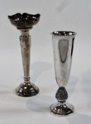 A modern silver flower vase, with flared rim and cylindrical tapering bowl, raised on a circular