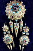 Indian gold-coloured metal and semi-precious stone suite of brooch and pair matching earrings,