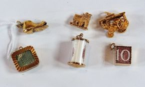 Six assorted 9ct gold charms, 22.8g approx.