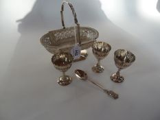 A silverplated sweetmeat stand with glass liner, open fretwork decoration with beaded border and
