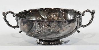 Georgian silver twin handled circular bowl, with foliate scrollwork repousse decoration, (with later