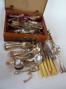 A large collection of assorted plated flatware, bone handled knives, knife rests, jam spoons etc