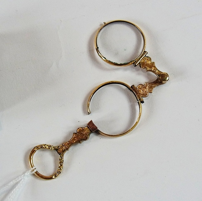 A pair of old pince-nez with gilt metal frames, cased