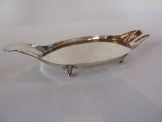 A late eighteenth century Continental silver oval stand with petal shaped handles, raised on foliate