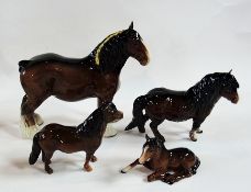 A Beswick pottery carthorse and foal together with two Beswick ponies (4)