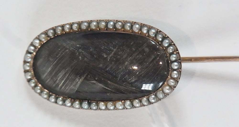Georgian memorial seed pearl set stick pin, the oval panel with plaited hair and surround of seed