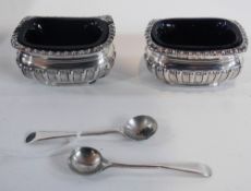 Pair Victorian silver open salts, reeded, repousse decoration, blue glass liners and spoons,