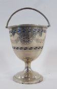 George V silver sugar bowl, with pierced fretwork decoration and foliate swag engraving, raised on a
