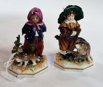 Pair of Capodimonte small figures of a girl and boy with pet dogs, height 9 cms