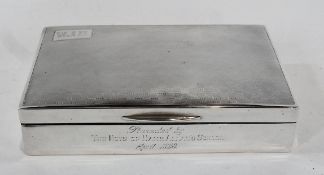 A George V silver rectangular cigarette box, with engine-turned chequerwork top, lined interior,