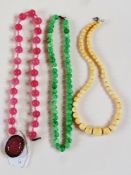 Glass beads and two other strings of beads (3)