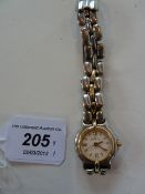 Lady's Bertolucci stainless steel watch with date aperture, with integral strap, inscribed to the