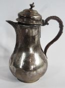 Edward VII silver hot water jug, of plain bulbous form, the hinged cover with finial, canework