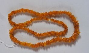 String of graduated uncut yellow amber beads