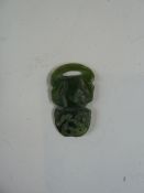 Small carved green jade pendant