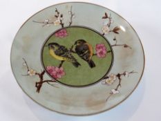 Pottery tazza, with painted birds and apple blossom, retailed by Phillips of London, impressed