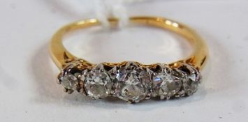 Gold five-stone diamond ring, the centre stone approximately .4