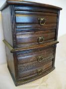 A miniature stained wood bowfront chest on chest of four drawers, 26 x 34 x 20cm