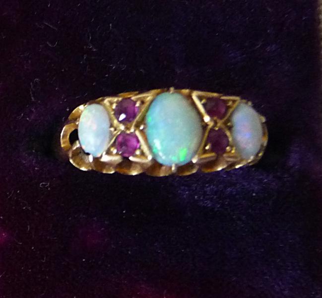Opal and ruby dress ring, with 18ct gold shank