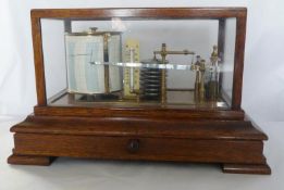 A late 19th/early 20th century oak and glass cased barograph with chart drawer