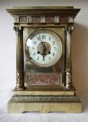 A late 19th century French brass mantel clock, the 8-day movement with enamelled dial, Arabic